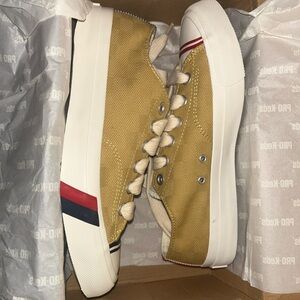 Yellow Sneakers with Red and Blue Accents